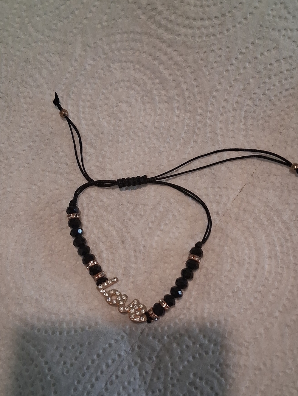 Bundle This Love-Script Beaded Adjustable Bracelet in Black and Gold